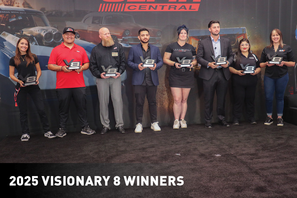 Group photo of the Visionary 8 winners and their awards