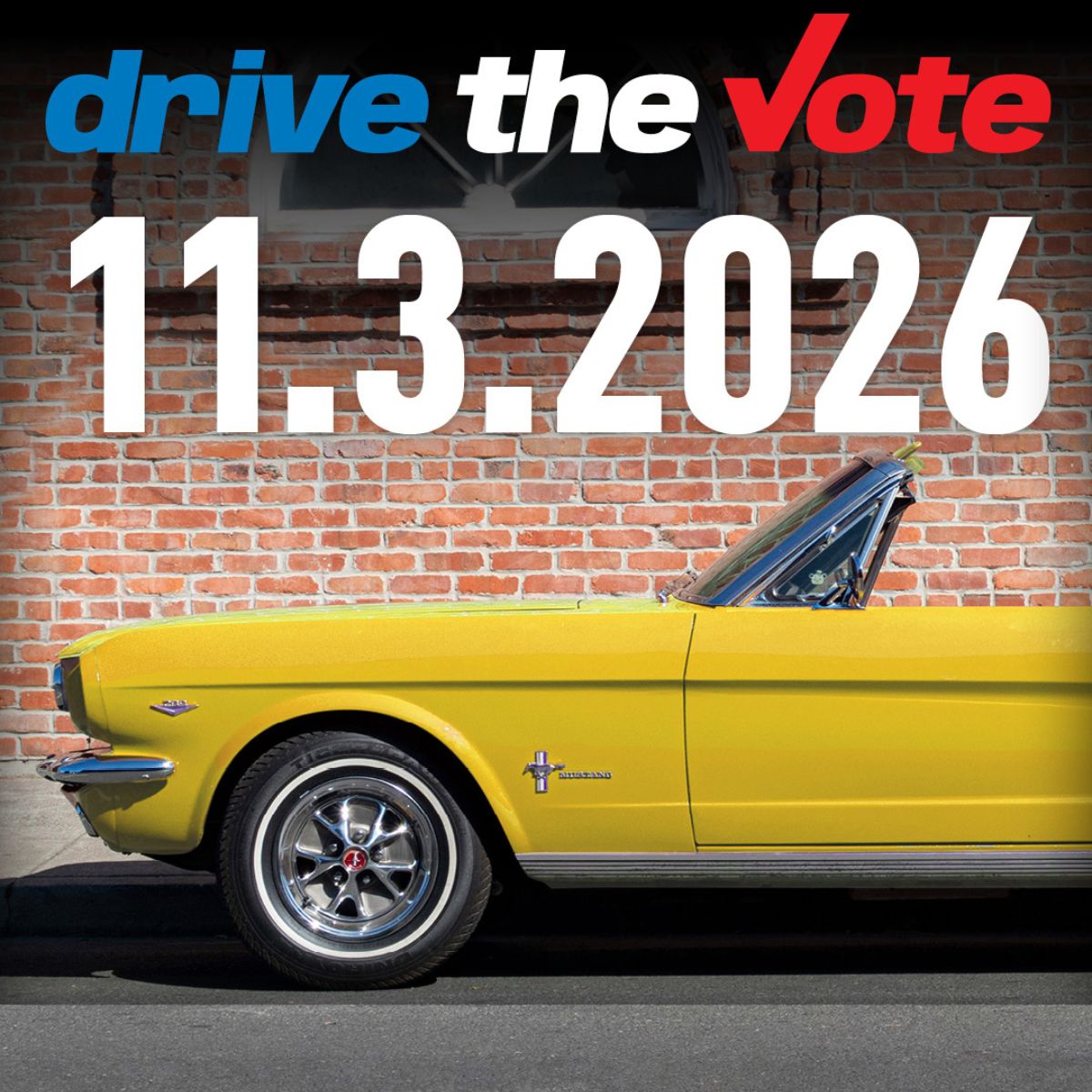 Mustang parked in front of a brik wall. Drive the Vote message.