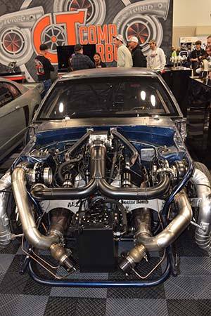 Race engine with twin turbos installed in dark blue car