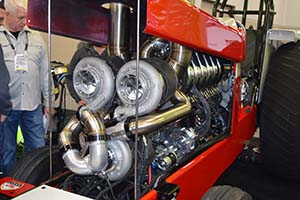 Three turbochargers installed on tractor pulling engine in red Case IH tractor