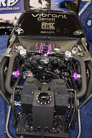 Black engine with purple accents in black race car