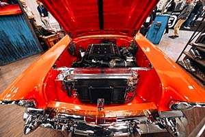 Supercharged engine with radiator and oil cooler in front of orange car