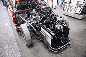 Front quarter shot of black race engine with ProCharger supercharger in red race car