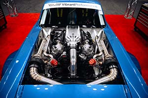 Race engine with Vibrant Performance parts installed in blue car