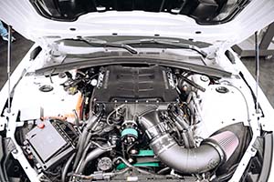 Black Magnuson supercharger installed in race engine in white car