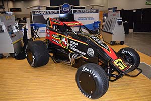 Black, red and yellow sprint car with 57 on hood