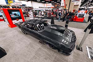 Dark gray race car with Edelbrock logo on hood