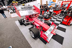 Red supermodified race car with Racing Wilwood decal on wing