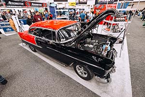 Black and red classic Chevrolet with hood up