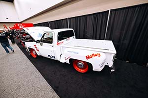 White truck with red wheels