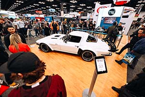 Classic white Chevrolet Corvette with black wing