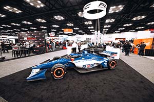 Side view of blue and white Indy car