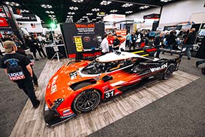 Orange and black race car with white roof