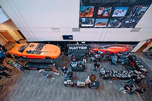 Above shot of orange race car in booth