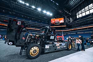 Side shot of black race truck with 88 on side