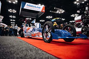 Dragster with red, white and blue America-themed decals on it