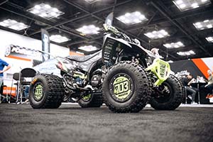 Black ATV with extra tread on tires