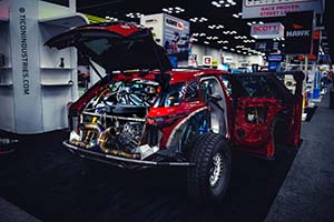 Engine installed in back of red Land Rover SUV with doors open